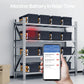 Storage rack with battery boxes and a hand holding a smartphone displaying a monitoring app.